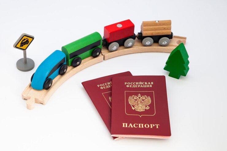 russian passport on a white background with and toy railroad 667325 90