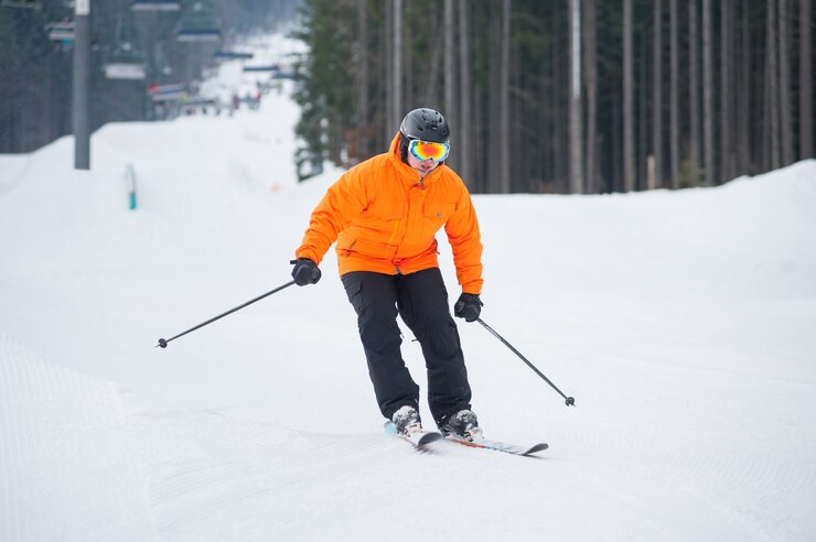 skier skiing downhill at ski resort against ski lift 10069 1841