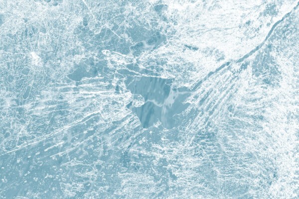 ice surface texture macro shot on a blue backgrond wallpaper