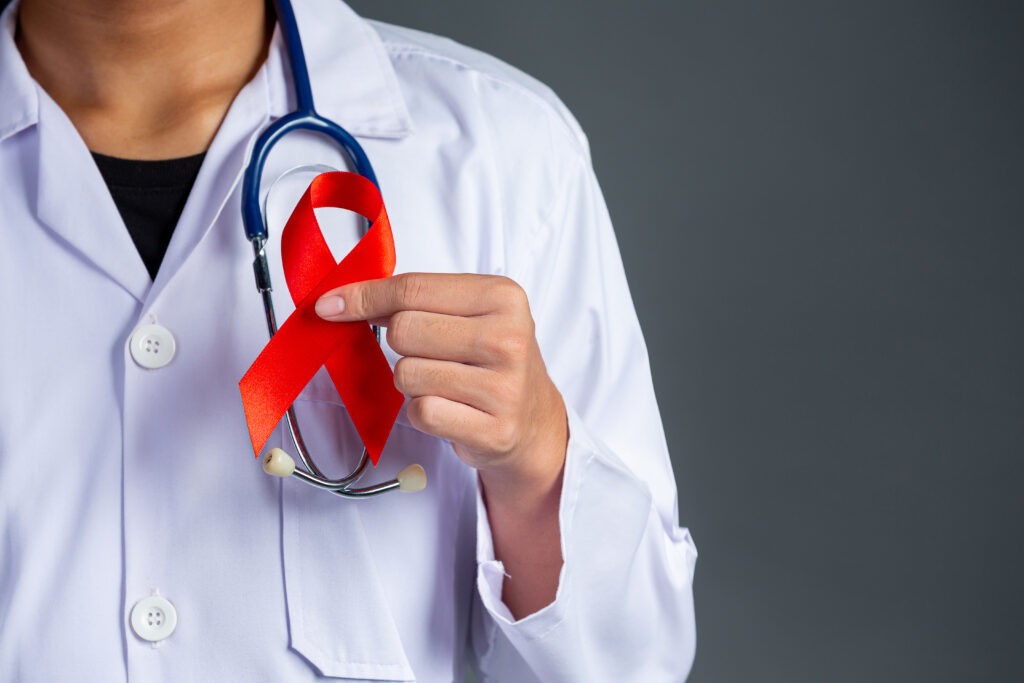 the doctor holds a red ribbon, hiv awareness awareness, world ai