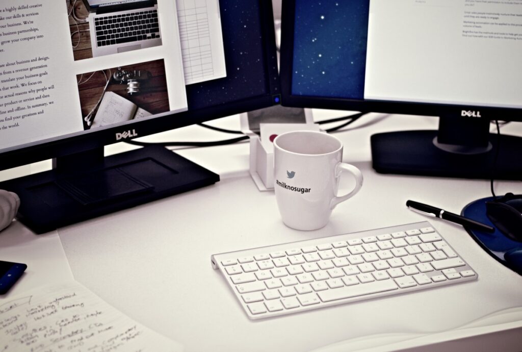 workstation home office computer coffee mug cup keyboard monitors displays 949588